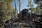 Ta Prohm temple - the badly ruined gopura of the gallery first found entering the site from west